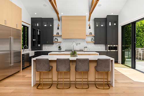 Restored kitchen with updated cabinets, countertops, and flooring after water damage.