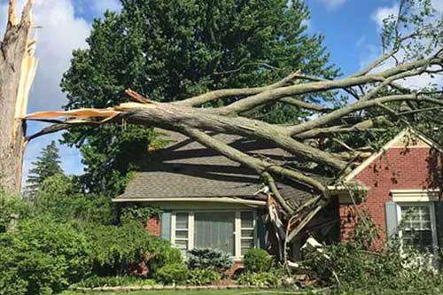 Restoration work in progress after storm damage to residential home